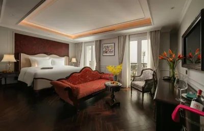 Grand Indochine Suite con balcón y vistas a la ciudad — La Mejor Indochine Hotel